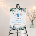 Blue Christmas Santa Baby Baby Shower Welcome Sign<br><div class="desc">Welcome your guests with wintery charm using our Blue Christmas Santa Baby Clothesline Baby Shower Welcome Sign! 💙❄️ This adorable design features sweet baby boy clothes hanging on a festive Christmas clothesline, surrounded by frosty blue snowflakes and lush holiday greenery. Perfect for a cozy winter baby shower, it’s easy to...</div>