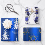 Blue Christmas Wrapping Paper Sheets<br><div class="desc">This striking blue Christmas wrapping paper set features three different, very festive patterns for your Christmas gift wrapping for the holiday season: a modern, minimalist Christmas tree pattern with white trees and the greeting, 'Be Merry'; the second sheet has a cute and whimsical pattern of little snowmen dressed in blue...</div>