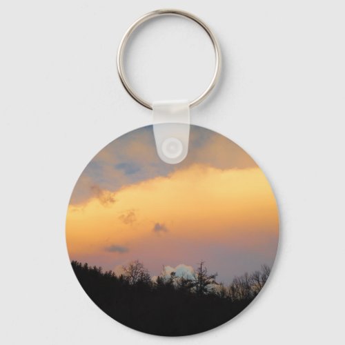 Blue clouds in a lavender sky keychain