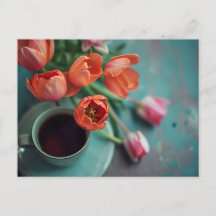 Blue coffee cup surrounded by colorful tulips