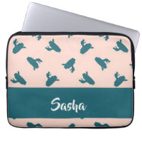 Blue coiled snakes on pink laptop sleeve