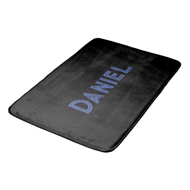 Blue custom name on black bath mat (Angled)