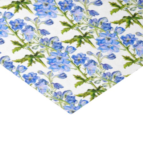 Blue delphinium flowers on white tissue paper
