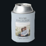Blue Engagement Party Photo We're Engaged Can Cooler<br><div class="desc">Keep the celebration cool with this personalized engagement can cooler. Featuring a soft light blue background, the joyful phrase “We’re Engaged!” stands proudly above your chosen photo and the couple’s names in graceful script. Designed to fit standard cans, it’s both practical and sentimental—ideal for engagement parties, proposal celebrations, and wedding...</div>