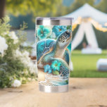 Blue Floral Tropical Turtle Insulated Tumbler<br><div class="desc">This tumbler wrap features a serene coastal scene centered around a tranquil sea turtle resting on soft sand, its shell glistening in oceanic hues of blue and green. Surrounding the turtle are delicate blue and white tropical flowers that add a gentle burst of color and charm. In the background, calm...</div>