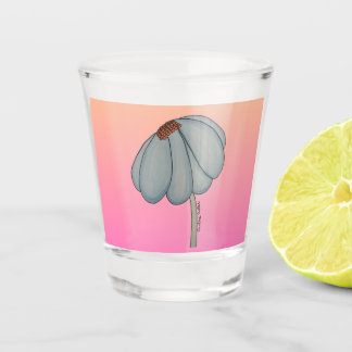 Blue flower with pink background shot glass