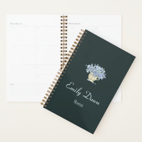 Blue flowers in vase gray planner