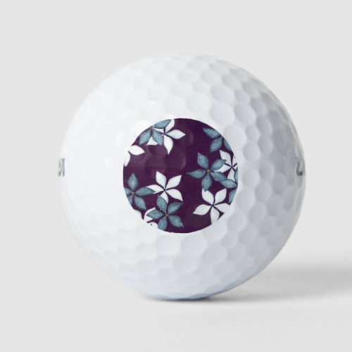 Blue flowers on plum background golf balls