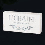 Blue Foliage | L'Chaim Typography with Family Name Wooden Box Sign<br><div class="desc">This stylish wooden box sign says "L'Chaim" in blue modern typography,  and is decorated with a branch of watercolor blue leaves. There is also room to add your family name to completely personalize. The perfect touch of decor for Hanukkah or any time of year!</div>