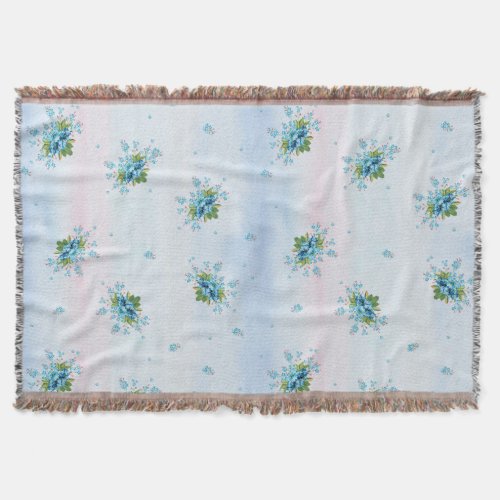 Blue forget_me_nots on a soft pink_blue throw blanket