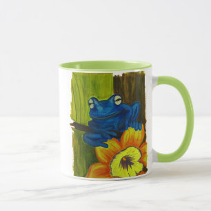 Blue frog relaxing on flower and tree branch mug