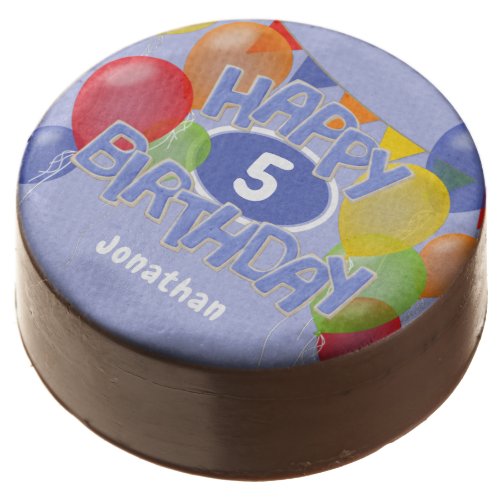 blue frosted cutout letters spell happy birthday chocolate covered oreo