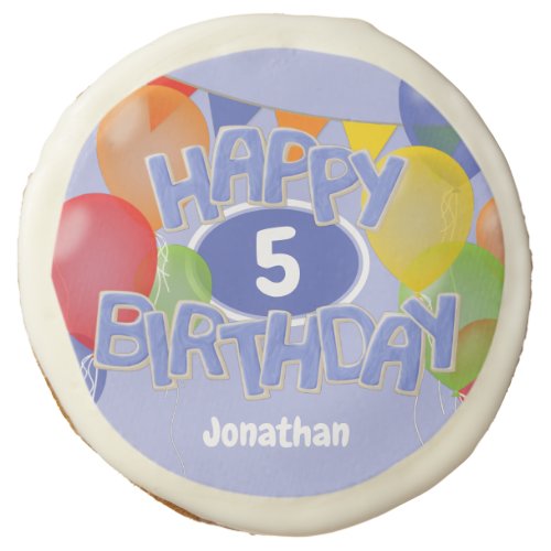 blue frosted cutout letters spell happy birthday sugar cookie