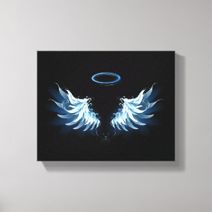 Blue Glowing Angel Wings on black background Canvas Print