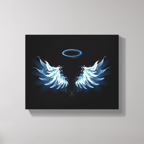 Blue Glowing Angel Wings on black background Canvas Print