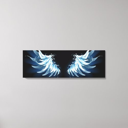 Blue Glowing Angel Wings on black background Canvas Print
