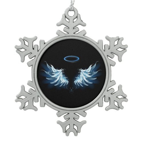 Blue Glowing Angel Wings on black background Snowflake Pewter Christmas Ornament