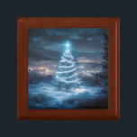 Blue Glowing Winter Night Christmas Tree Gift Box<br><div class="desc">A glowing blue Christmas tree standing peacefully in a snowy landscape. Illuminated by soft winter lights and crowned with a radiant star,  the tree shines against a dreamy night sky overlooking a quiet,  glowing town below.</div>