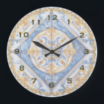 Blue Gold white Talavera Azulejo look Wall Clock<br><div class="desc">Pretty Blue gold and white Italian or Portuguese tile look kitchen wall clock.  There is a matching coffee mug and tea towel.

See another similar clock:
https://www.zazzle.com/blue_gold_white_talavera_azulejo_look_wall_clock-256694712722411141</div>