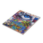 Blue graffiti evil eye tile<br><div class="desc">Colorful distressed modern urban graffiti photo on a city wall, in Prague with a blue evil eye and multicolored graffitied words and text.</div>