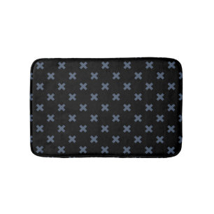 Blue-gray cross stitches on black bath mat