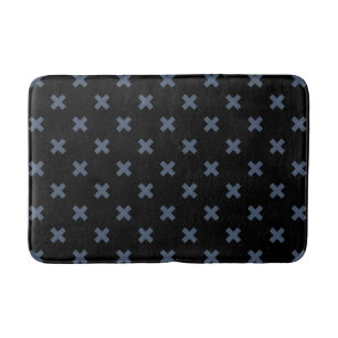 Blue-gray cross stitches on black bath mat