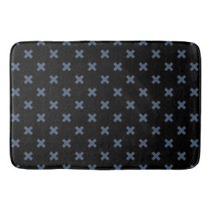 Blue-gray cross stitches on black bath mat