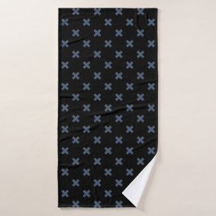 Blue-gray cross stitches on black bath towel