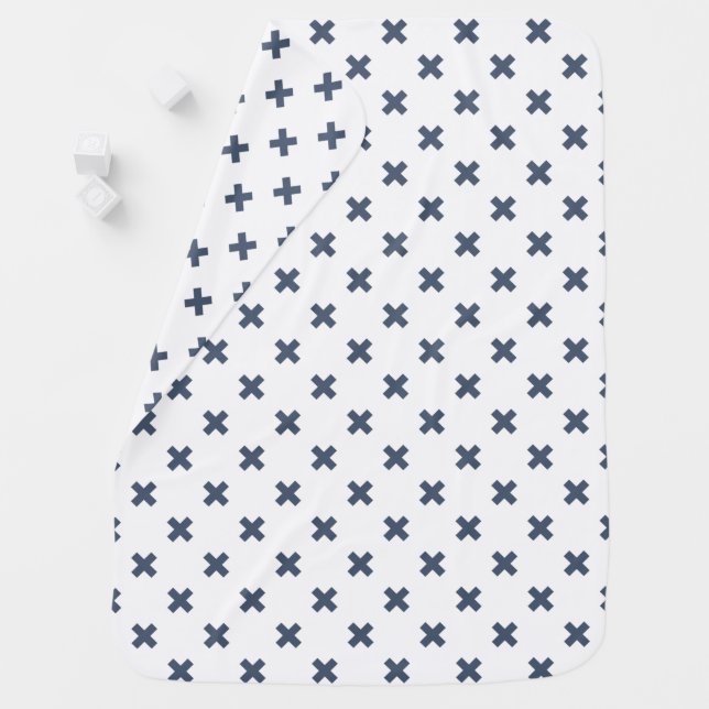 Blue-gray cross stitches on white baby blanket (In Situ)