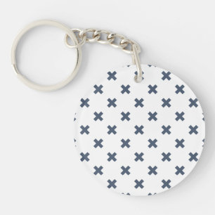 Blue-gray cross stitches on white keychain
