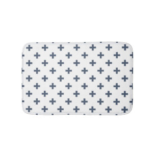 Blue-gray polka crosses on white bath mat