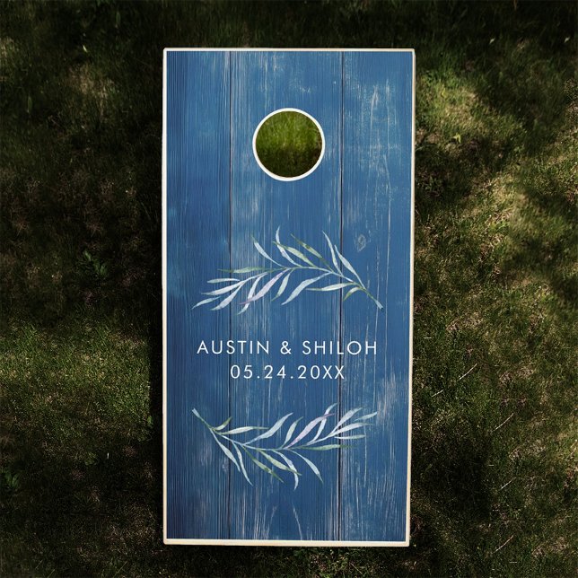 Blue & Green Romantic Botanical Greenery Wedding Cornhole Set (Cornhole board with blue wood texture, adorned with delicate white and green leafy designs.)
