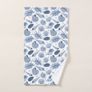 Blue hand drawn seashells on white towel 