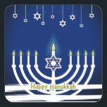 Blue Happy Hanukkah Star Menorah Candle Lights Square Sticker<br><div class="desc">Celebrate the Festival of Lights in style with these lovely Happy Hanukkah stickers. This festive design features a white candlelit menorah on a blue background with Happy Hanukkah written at the bottom in gold. Small decorative Magen David or Star of David hang from the top of the design. Great for...</div>