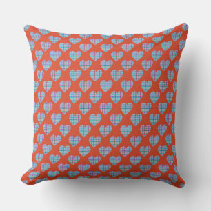 Blue hearts on red throw pillow