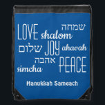 Blue Hebrew Hanukkah Drawstring Bag<br><div class="desc">Stylish HANUKKAH Drawstring Bag with LOVE JOY PEACE including Hebrew translations in black typography against a TEKHELET BLUE background. Text is CUSTOMIZABLE, in case you wish to change anything. HAPPY HANUKKAH is also customizable, so you can replace with a name or initials. Part of the HANUKKAH Collection. Matching items are...</div>