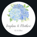 Blue Hydrangea Watercolor Floral Wedding Classic Round Sticker<br><div class="desc">These wedding stickers feature blue hydrangeas and leaves. Personalize them with your names and wedding date. These stickers are ideal for use as envelope seal stickers or for decorating wedding favors. These stickers are part of a collection which includes a range of matching wedding stationery. Please visit the collection page...</div>