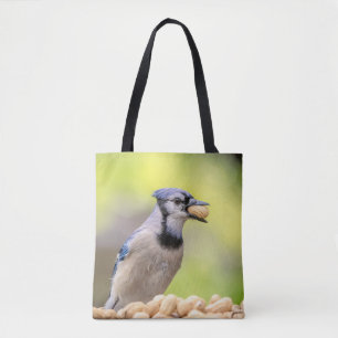 Blue jay with a peanut tote bag