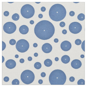 Blue knitted circles on a white background fabric