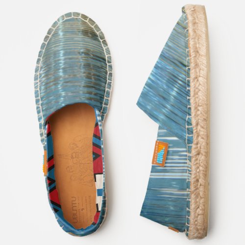 blue lake water reflection red white blue liner espadrilles