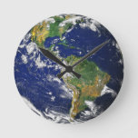 Blue Marble_whole World In Your Hands Round Clock at Zazzle