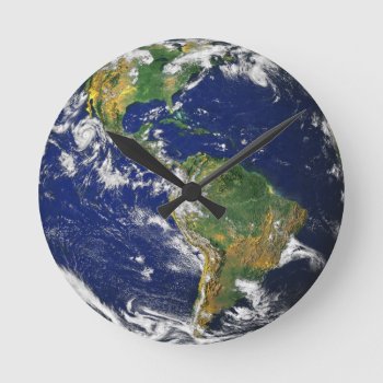 Blue Marble_whole World In Your Hands Round Clock by UCanSayThatAgain at Zazzle