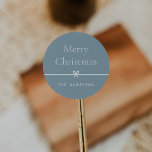 Blue | Modern Bow Simple Minimal Christmas Classic Round Sticker<br><div class="desc">Finish your holiday mailings and gifts with these sweet and simple Christmas stickers,  customizable with your preferred holiday greeting and family signature (shown with "Merry Christmas") on a soft blue background. A petite bow running through the center completes this elegant minimalist holiday design.</div>