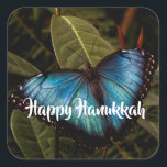 Blue Morpho, Butterfly Happy Hanukkah Square Sticker<br><div class="desc">Blue Morpho butterfly shows off his brilliant,  blue wings ( 5 - 8 inches span) while resting on foliage at Butterfly Wonderland. Ready to send your Hanukkah greetings. Photo by Ruth Jolly. The text is fully customizable to meet your needs.</div>