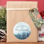 Blue Mountain Pines Festive Merry Christmas Classic Round Sticker<br><div class="desc">These fun stickers are perfect as envelope seals or gift tags. They feature a rustic watercolor design of blue pine trees shrouded in mist or fog. The caption reads: "wishing you and yours a very Merry Christmas!" There is space for your name and the year below.</div>