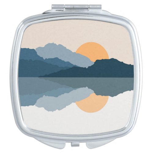 Blue mountains reflected in the lake compact mirror