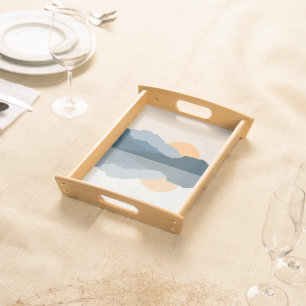 Blue mountains reflected in the lake serving tray