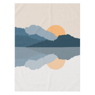 Blue mountains reflected in the lake tablecloth