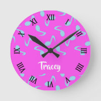 Blue musical notes on pink round clock