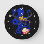 blue octopus playing multiple percussion.png round clock